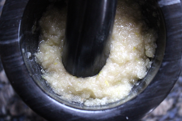 Pounding Garlic into Paste