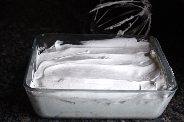 dandelion honey marshmallow batter in a pan starting to set into homemade marshmallows