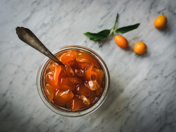 Candied Kumquats in a Jar on a Counter