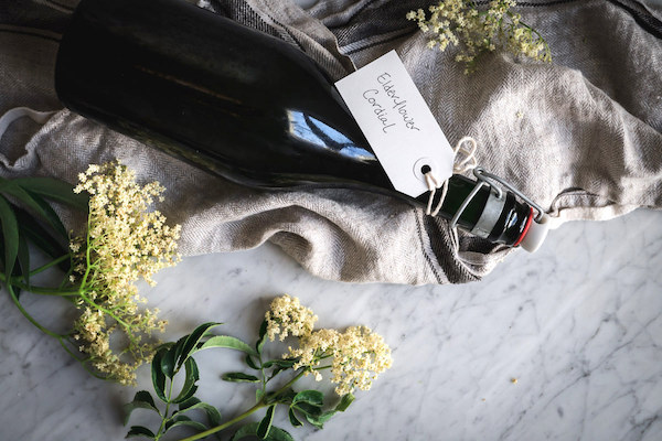 A bottle of homemade elderflower cordial