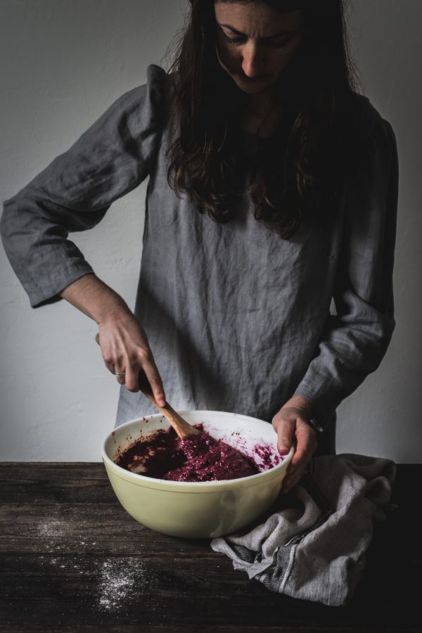 Woman mixing the batter for a chocolate beetroot cake