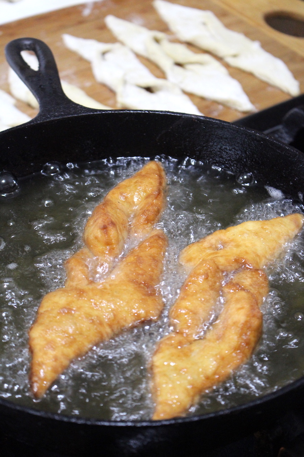 two kleinur frying side by side in a cast iron frying pan