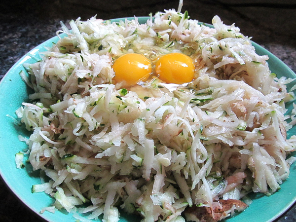 Adding eggs to zucchini latkes