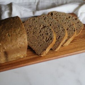 Bread machine zucchini bread loaf with golden crust and moist tender spiced quick bread crumb