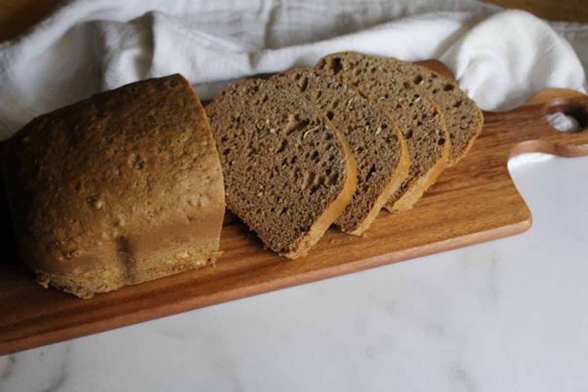 Bread machine zucchini bread loaf with golden crust and moist tender spiced quick bread crumb