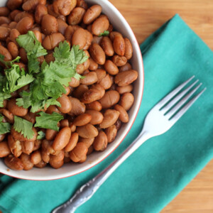 Pinto beans cooked in an instant pot and displayed in a bowl on the table.