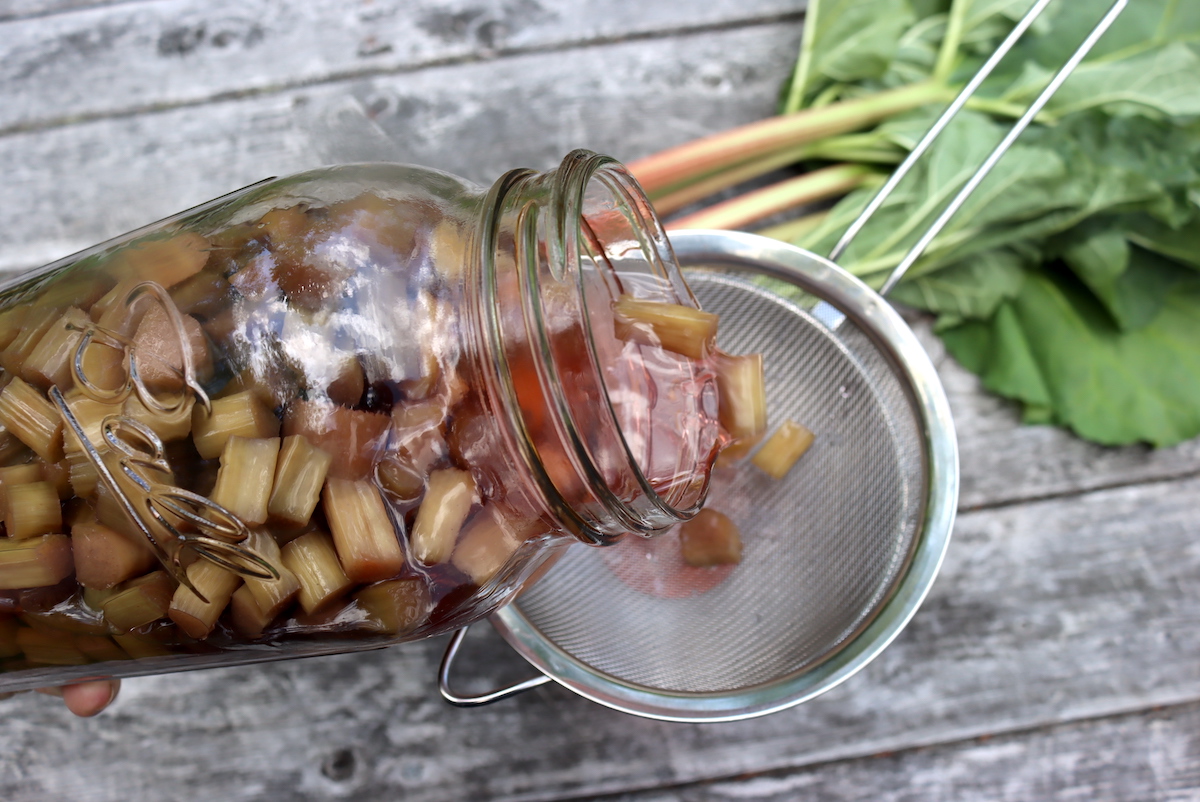 Straining Rhubarb Liqueur