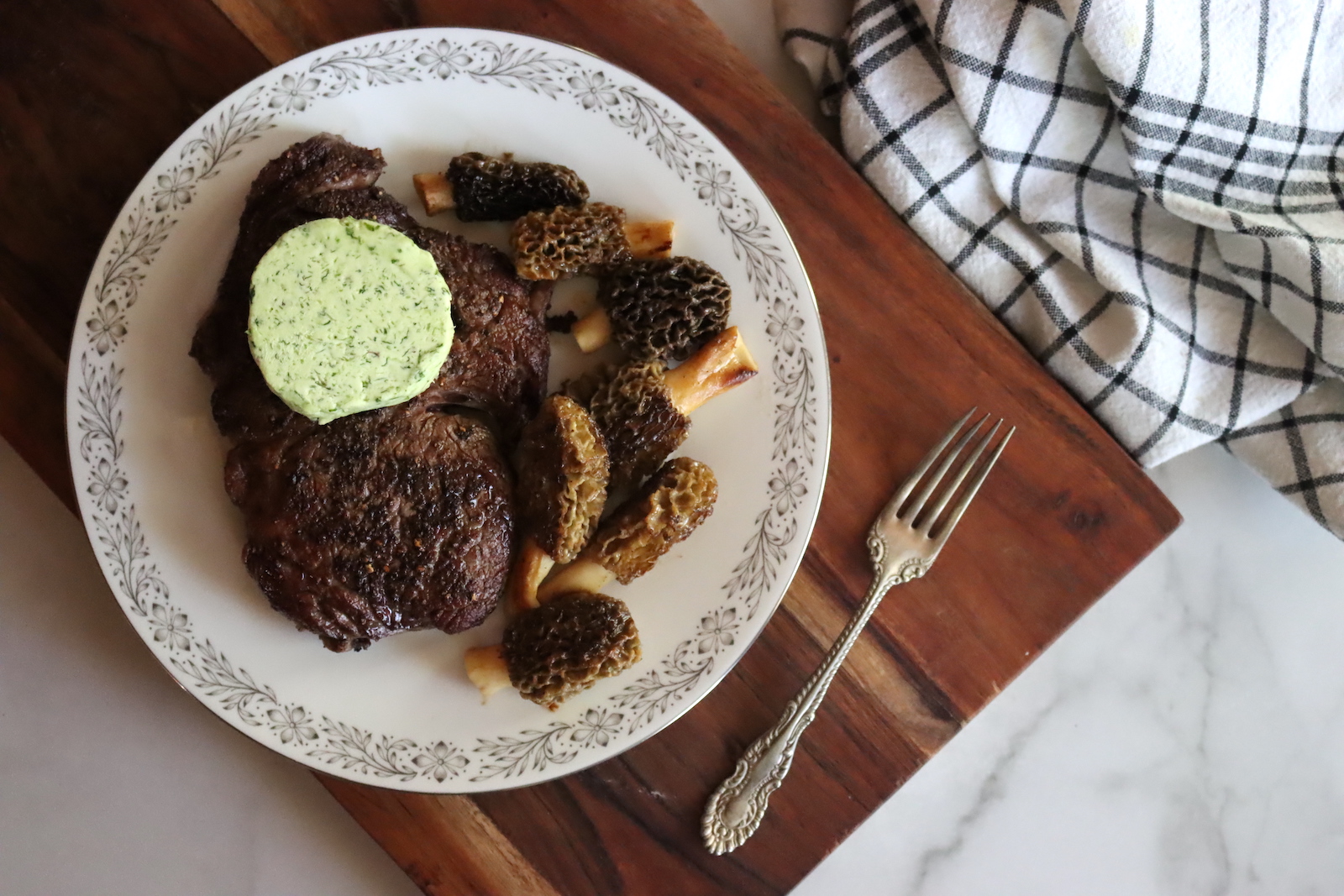 Ramp compound butter with steak and morels