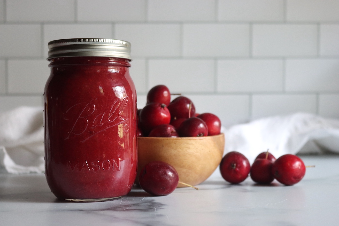 Pink crabapple sauce in a jar